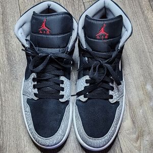 Authentic black and gray Jordan Ones. They're used but in good condition.